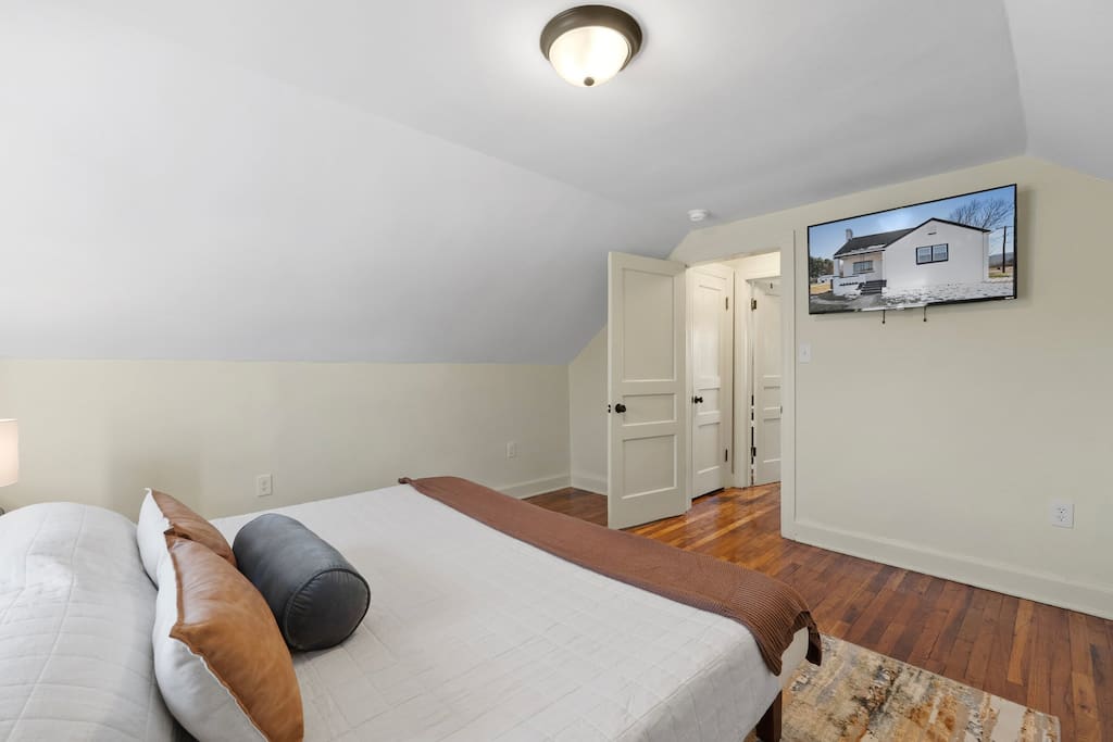 Upstairs master bedroom with smart TV