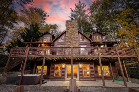 Take in the beautiful log cabin architecture with soaring ceilings and custom windows