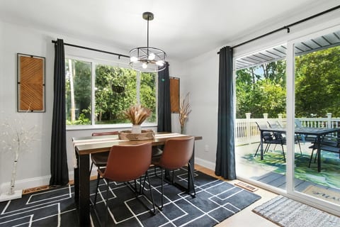 The dining room has seating for four with two additional seats at the peninsula.