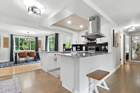 The kitchen is fully equipped with everything you need to prepare and enjoy home-cooked meals, including a full-size stove and oven, small microwave, refrigerator, dishwasher, pots and pans, cooking utensils, dishes, glassware, and more.