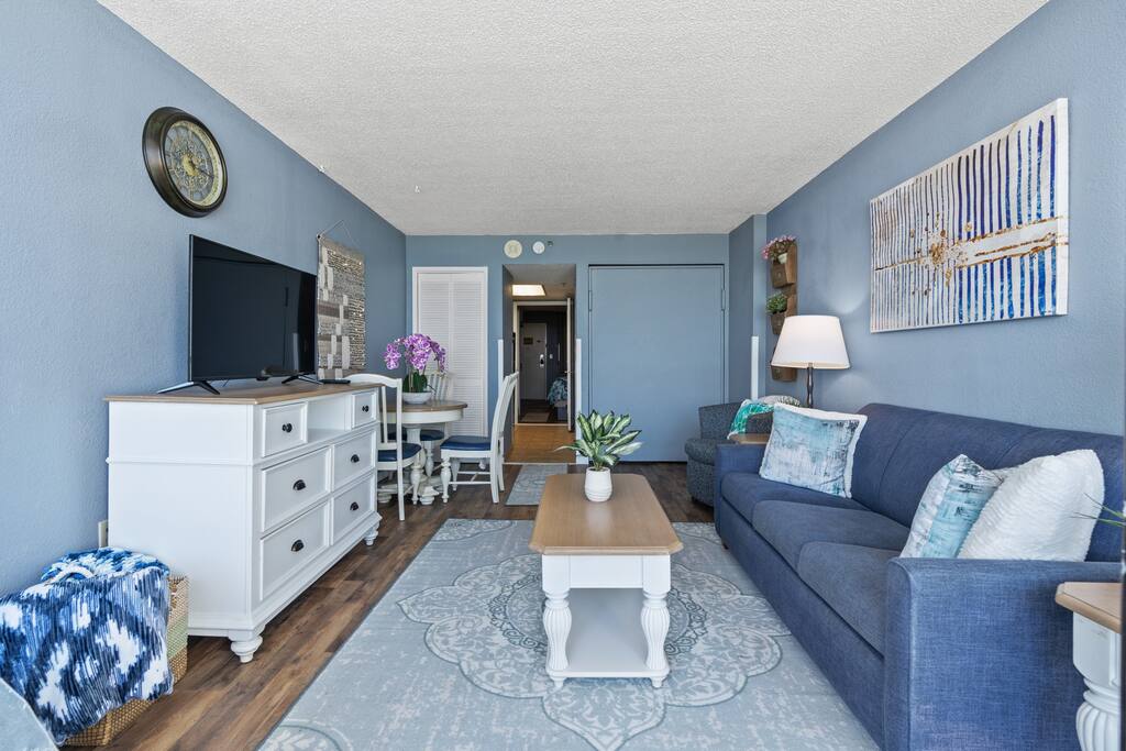 Discover a sanctuary of relaxation in our thoughtfully decorated living room, providing a peaceful retreat for your stay.