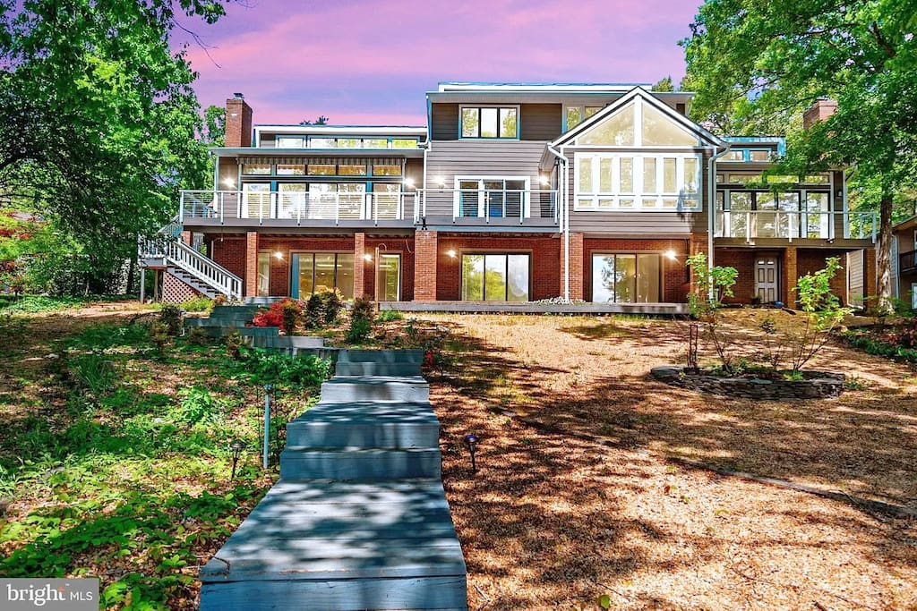 Here is the house from the lake side.  These stairs lead to a beautiful dock where you an relax or fish or swim.  A dream for all ages.  