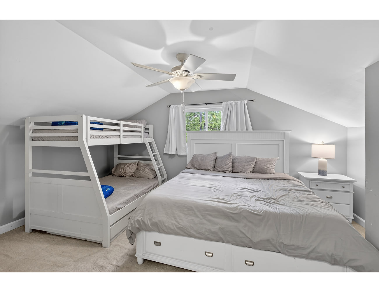 Family-friendly loft room with king + bunk, fan, and storage