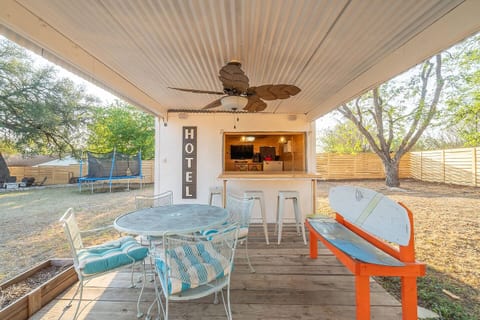 Experience the pleasure of alfresco dining, boasting a picturesque outside dining area. Embrace the serene atmosphere as you gather around the stylish table set amidst a lush garden.