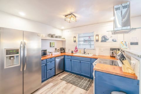 Our inviting kitchen is the heart of the home, boasting a house sink, a gas range, and plenty of space for meal preparation.