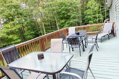 Serene Escape in the Treetops: Relax and Rejuvenate on our Elevated Deck Balcony with a Mesmerizing Forest View.