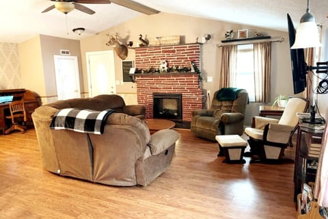 Escape to our cozy living room, where you can cozy up by the fireplace and enjoy a cup of hot cocoa.