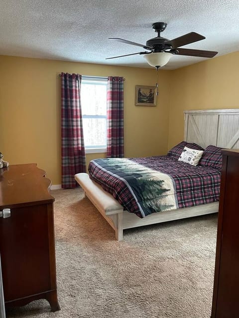 Experience true tranquility in this well-appointed room with a plush queen-size bed, perfect for a couple seeking a romantic escape.