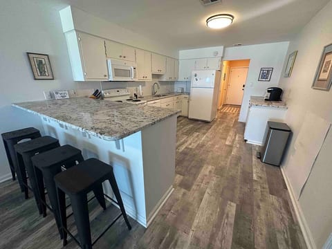 Enjoy the convenience of our open-concept kitchen, seamlessly connected to the dining area, making it perfect for entertaining.