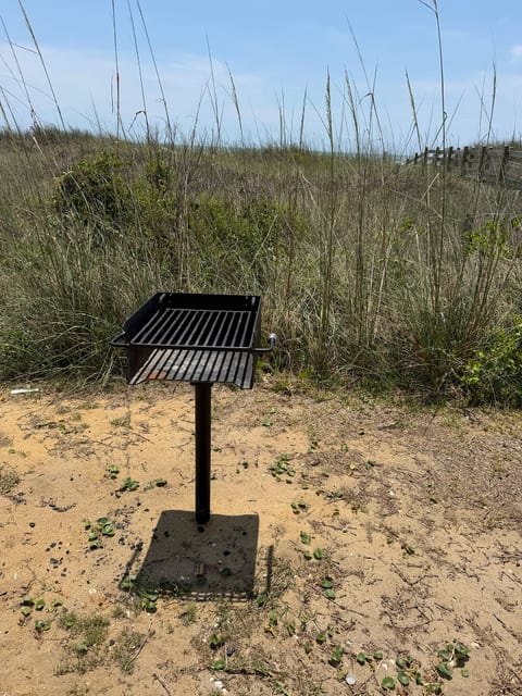 Beachside outdoor grill nestled by the dunes for easy cookouts