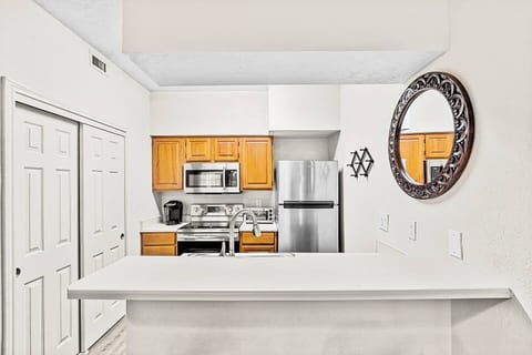 Relax in a bright, modern kitchen with stainless steel appliances and a spacious breakfast bar perfect for morning coffee. A stylish space to call your own!
