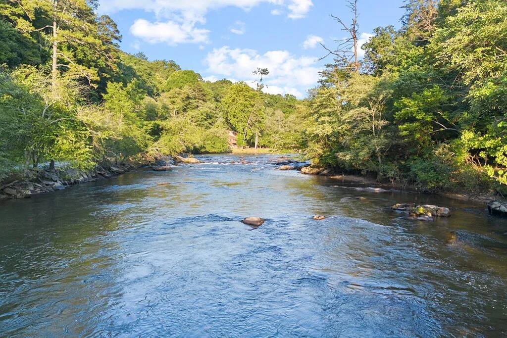 The crystal clear Coosawattee River that surrounds the backyard... it's breathtaking! It's cold and clear most of the year! Occasionally after a storm it can get a bit muddy for a day or an afternoon,  but it clears quickly!