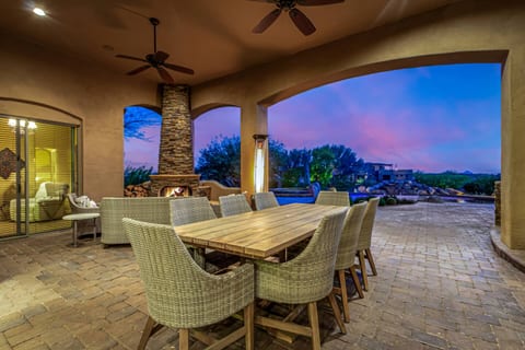 Picture yourself enjoying stunning Arizona sunsets from your spacious covered patio, perfect for al fresco dining or cozy chats by the fireplace. Your private outdoor oasis awaits!