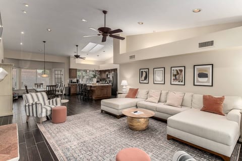 Spacious living area with natural light and an open floor plan that flows seamlessly into the kitchen and dining spaces.