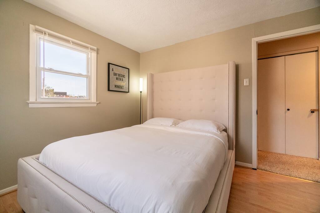 Queen size bed and a lamp with adjustable light settings for your liking.