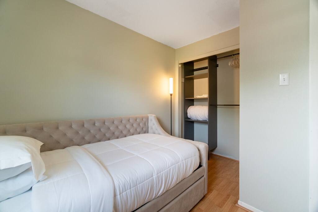 The second bedroom has a comfy twin sized day bed and a convenient trundle bed tucked underneath.