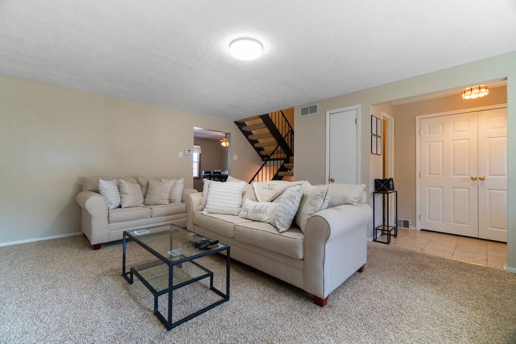 Cozy and spacious living room. Sit back, relax and unwind on our comfortable sofa. Place your food and drinks at arm's reach on our stylish glass coffee table for convenience. 