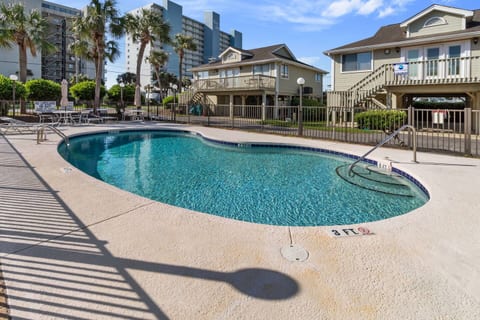 Relax in your own coastal retreat, just a walk away from the beach. This cottage features a sparkling pool for you to cool off in and unwind. Enjoy the ocean breeze from the patio or lounge by the pool after a day of fun in the sun.