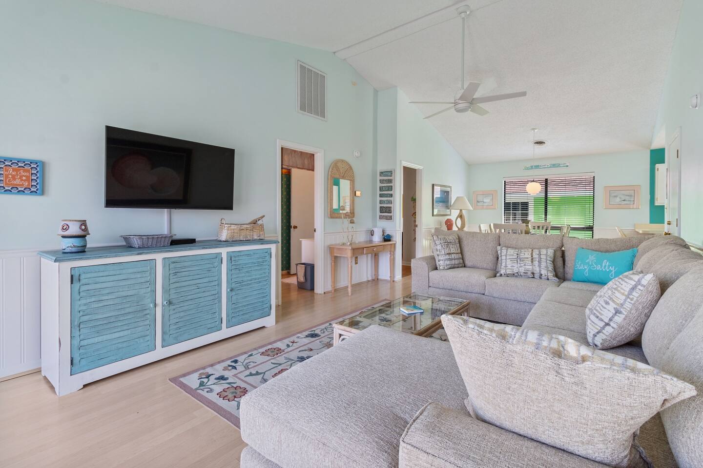 Escape to your coastal oasis! Sink into the spacious sectional after a day of adventure. Enjoy the open-concept design perfect for gathering with loved ones, all with a serene, ocean-inspired vibe.