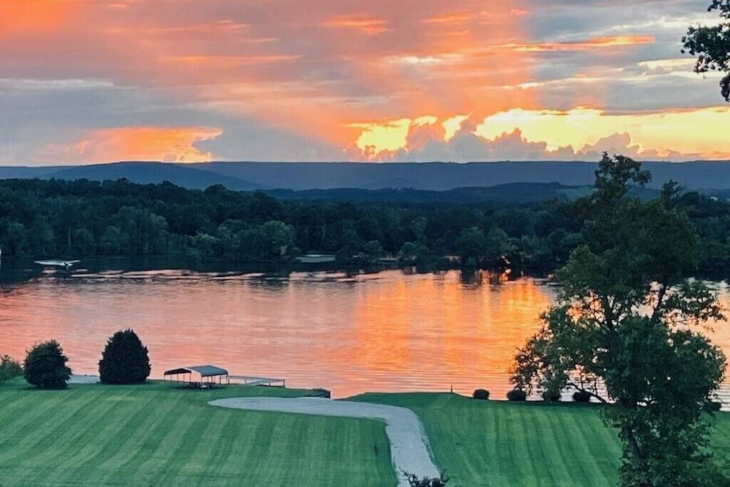 Golden sunset reflecting on the lake—unmatched evening views right from the backyard.