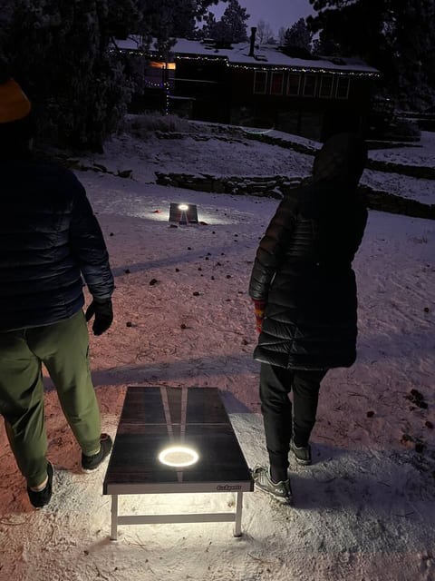 Light-up cornhole set for nighttime fun in the snow—perfect for group games and making memories.