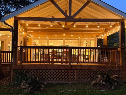 Imagine yourself dining under the stars on a cozy, covered deck with twinkling string lights. This is your perfect retreat to relax and make memories.