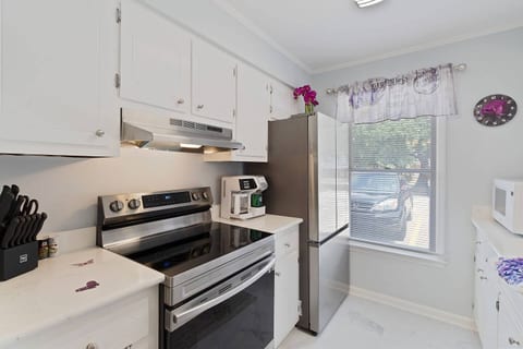 Welcome to a kitchen with all the essentials you need to prepare meals during your stay. Enjoy the modern appliances, ample counter space, and a bright atmosphere to start your day right.