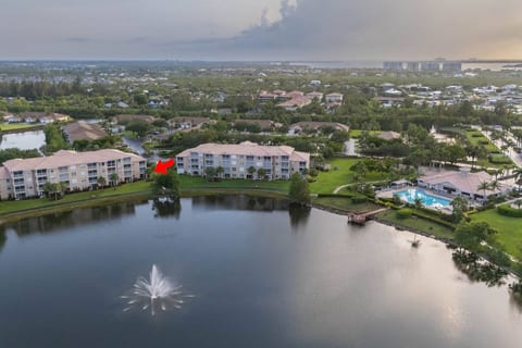 Sunny lakeview condo in Fort Myers, Florida, with a pool. This peaceful retreat is perfect for relaxing and enjoying the outdoors with walking trails nearby.