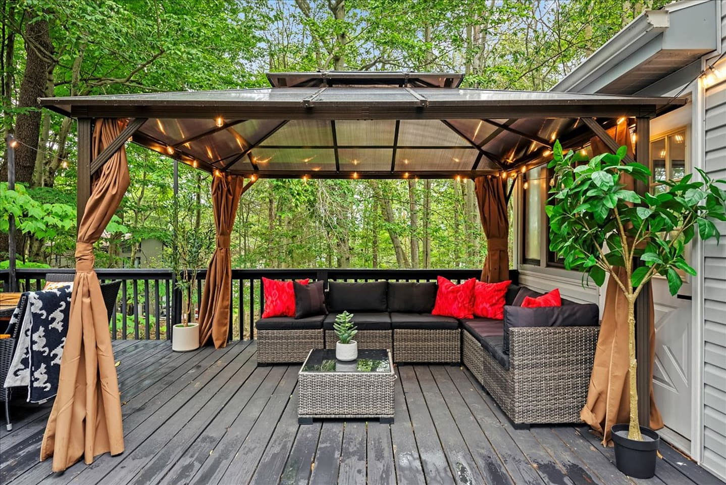 Imagine relaxing with your coffee under the covered gazebo, nestled on plush outdoor seating. This is your private oasis, perfect for unwinding after a day of adventure.