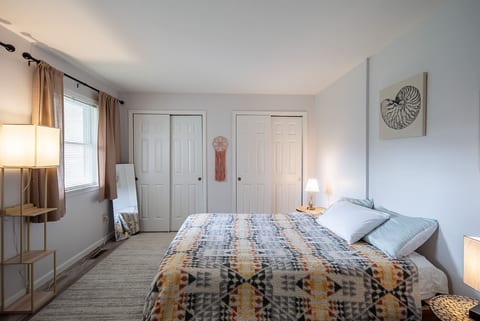 Wake up to soft natural light in this serene retreat, designed for both comfort and relaxation.