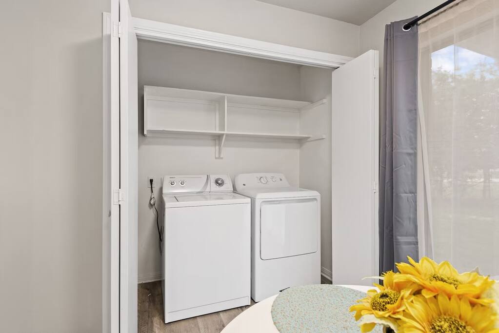 In-unit washer and dryer with shelving, laundry convenience at your fingertips.