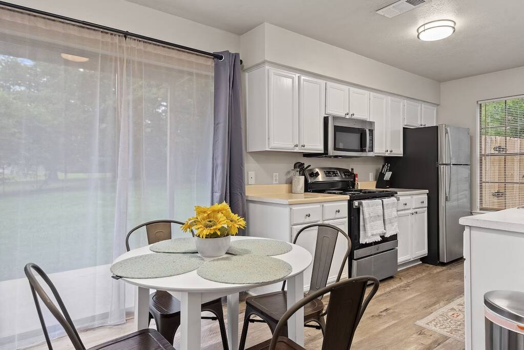 Open dining space connected to a fully equipped kitchen for easy meals.