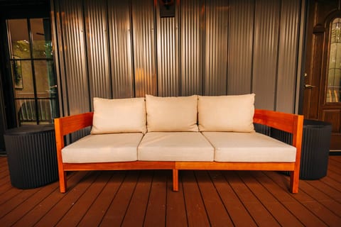 Sink into this comfy cushioned sofa after a day of adventure and unwind under the softly glowing outdoor lights.
