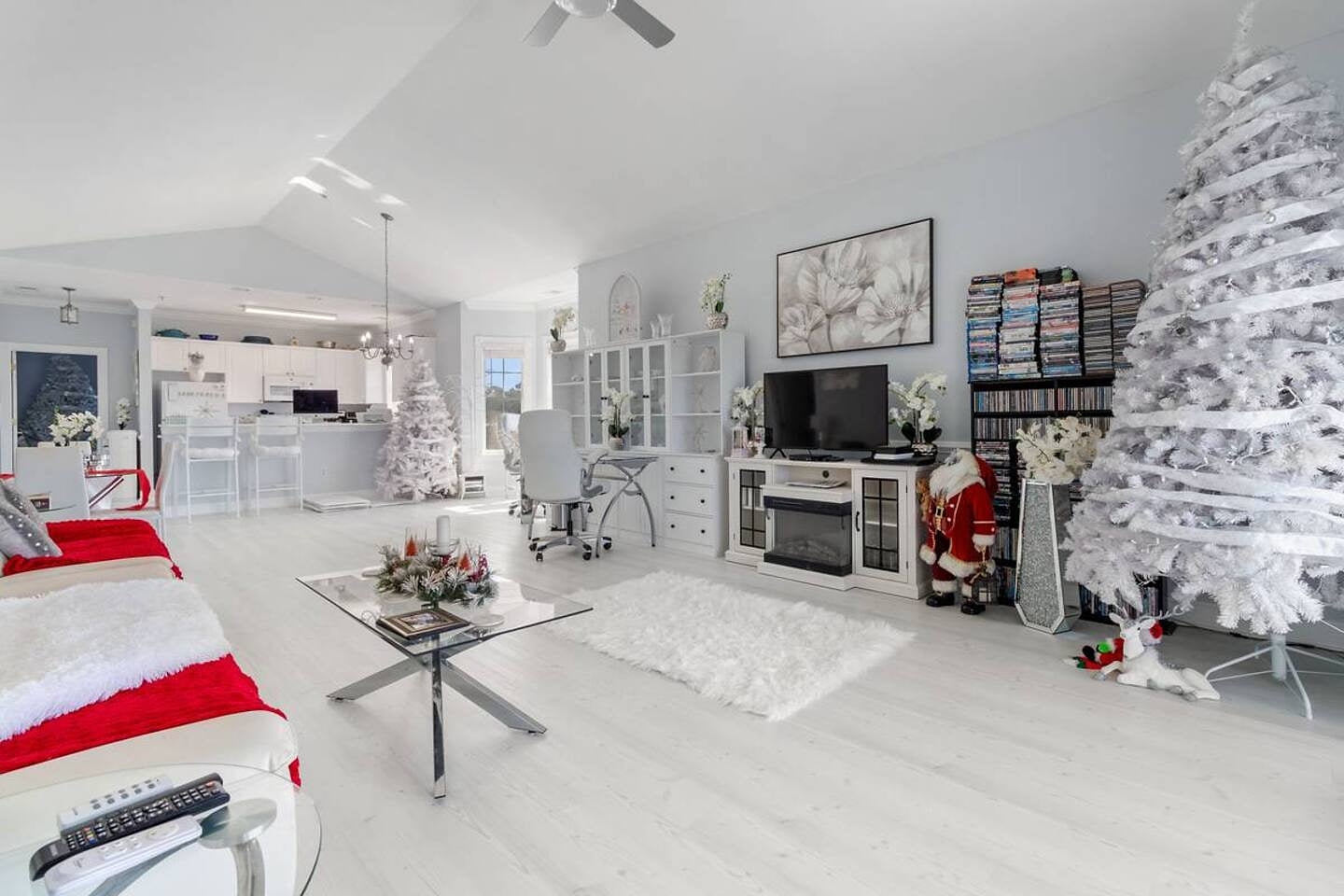 Step into your serene winter getaway. The open-plan living area invites you to relax by the fireplace and enjoy a bright, clean space. Feel the warmth of the holidays.