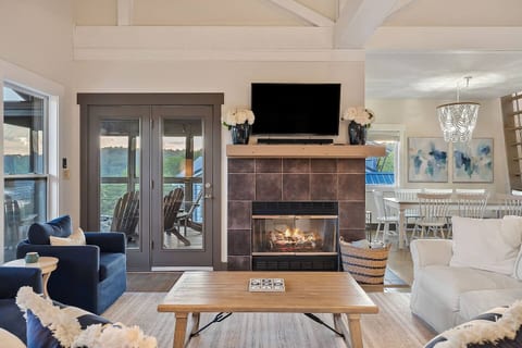 Well appointed living room offers ample seating, stunning views, blankets and gas fireplace to enjoy football games, movies, books and time with family and friends.