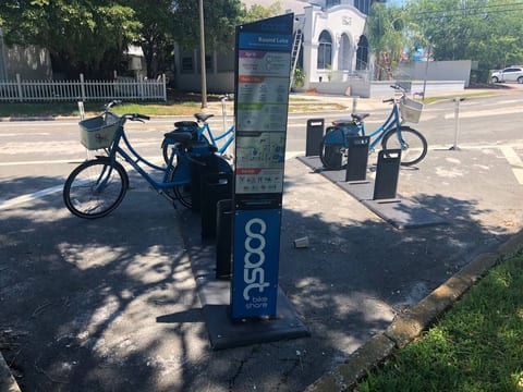 Pick up a share bike in the park and bike to the waterfront