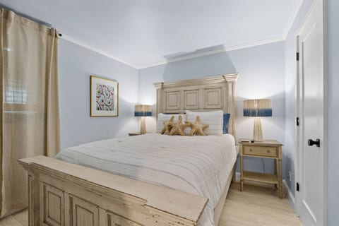 Bedroom – Relax in a serene bedroom with plush bedding and beachy décor.