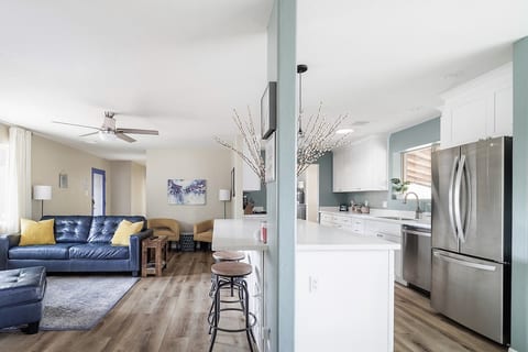 Lots of natural light in the Great Room for visiting, reading, or just enjoying nature out the large energy efficient windows.
There is seating for 6 to 8 people. Or you can read a good book by the fireplace.