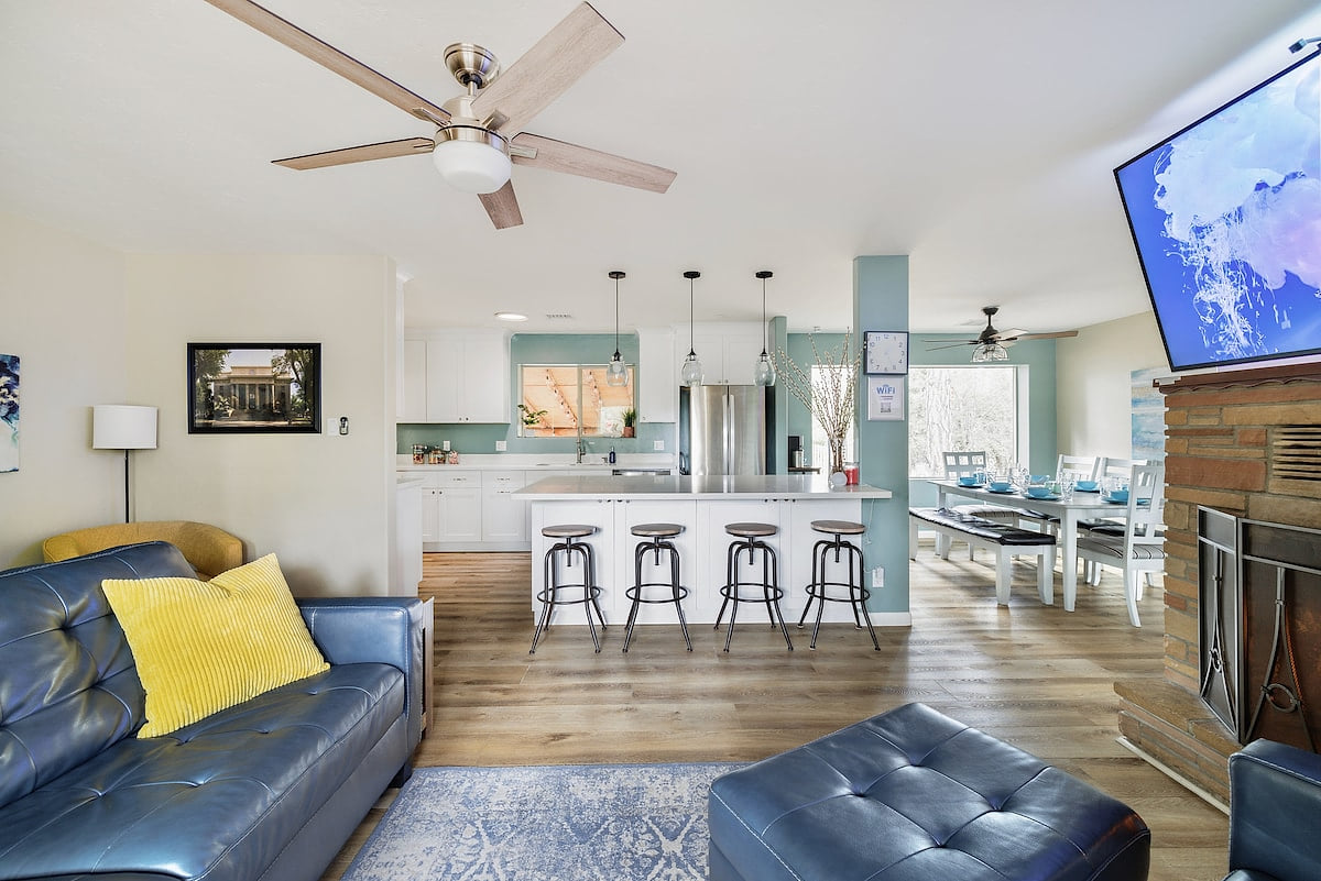 The family opens to the kitchen. There is extra seating at the kitchen island with quartz countertops.