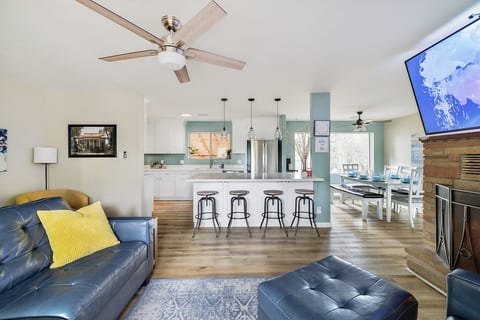 The family opens to the kitchen. There is extra seating at the kitchen island with quartz countertops.