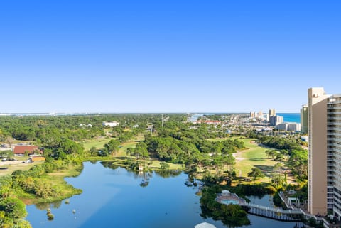 Enjoy scenic views of the lake, golf course, and Gulf coastline right from your private balcony