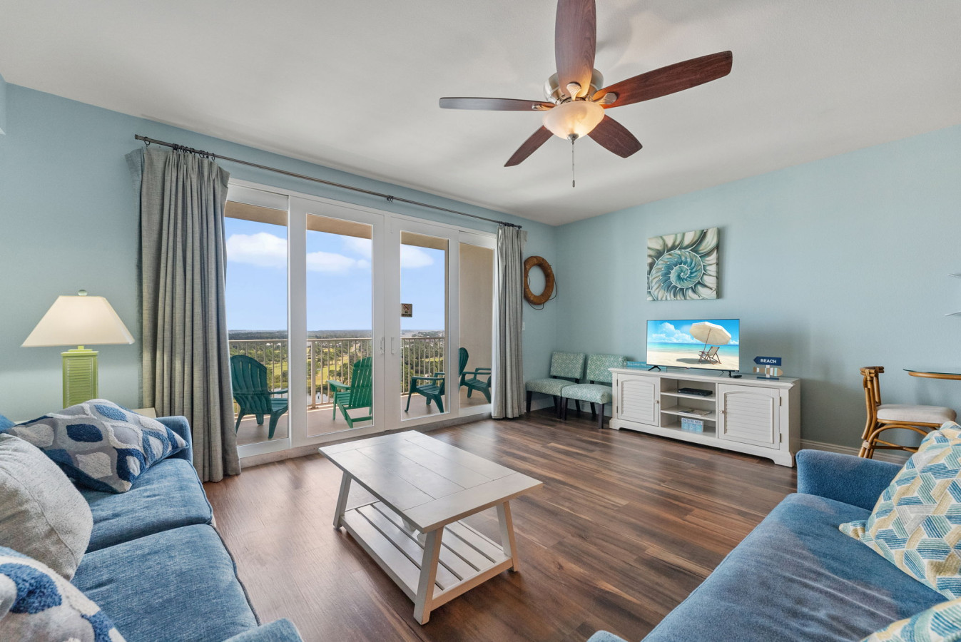 Balcony Access: Relax on the queen-size sleeper sofa and enjoy stunning lake and resort views through large sliding glass doors.