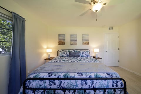 Master Bedroom: Bright and breezy retreat with beachy decor and plenty of natural light!