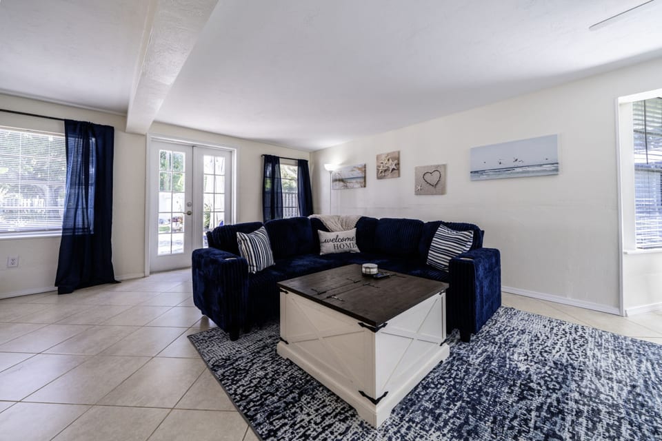 Living Room: Relax on plush seating and enjoy beachy decor in this bright, inviting space!