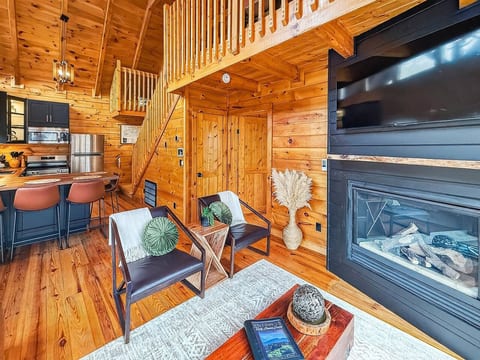 Morning light, warm fire, and trees outside your window. This is cabin living done right