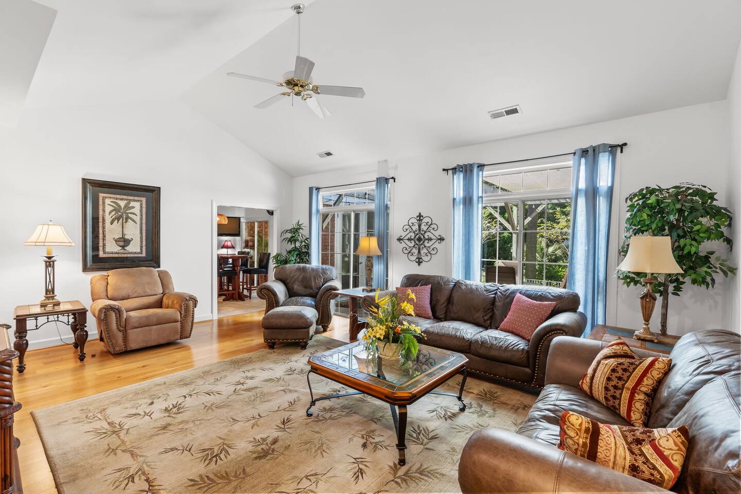 Bright and welcoming living room with cozy seating, a TV, and homey charm, perfect for relaxing or gathering with family and friends!