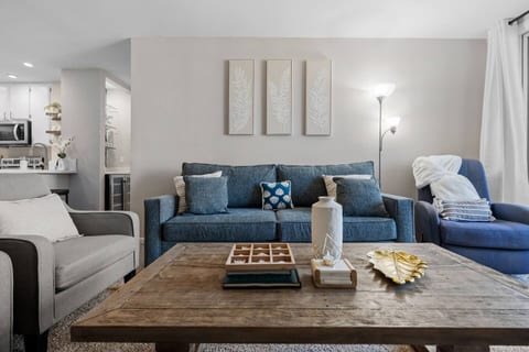 Bright, open living space with coastal-inspired décor — the perfect spot to unwind after a day in the sun.