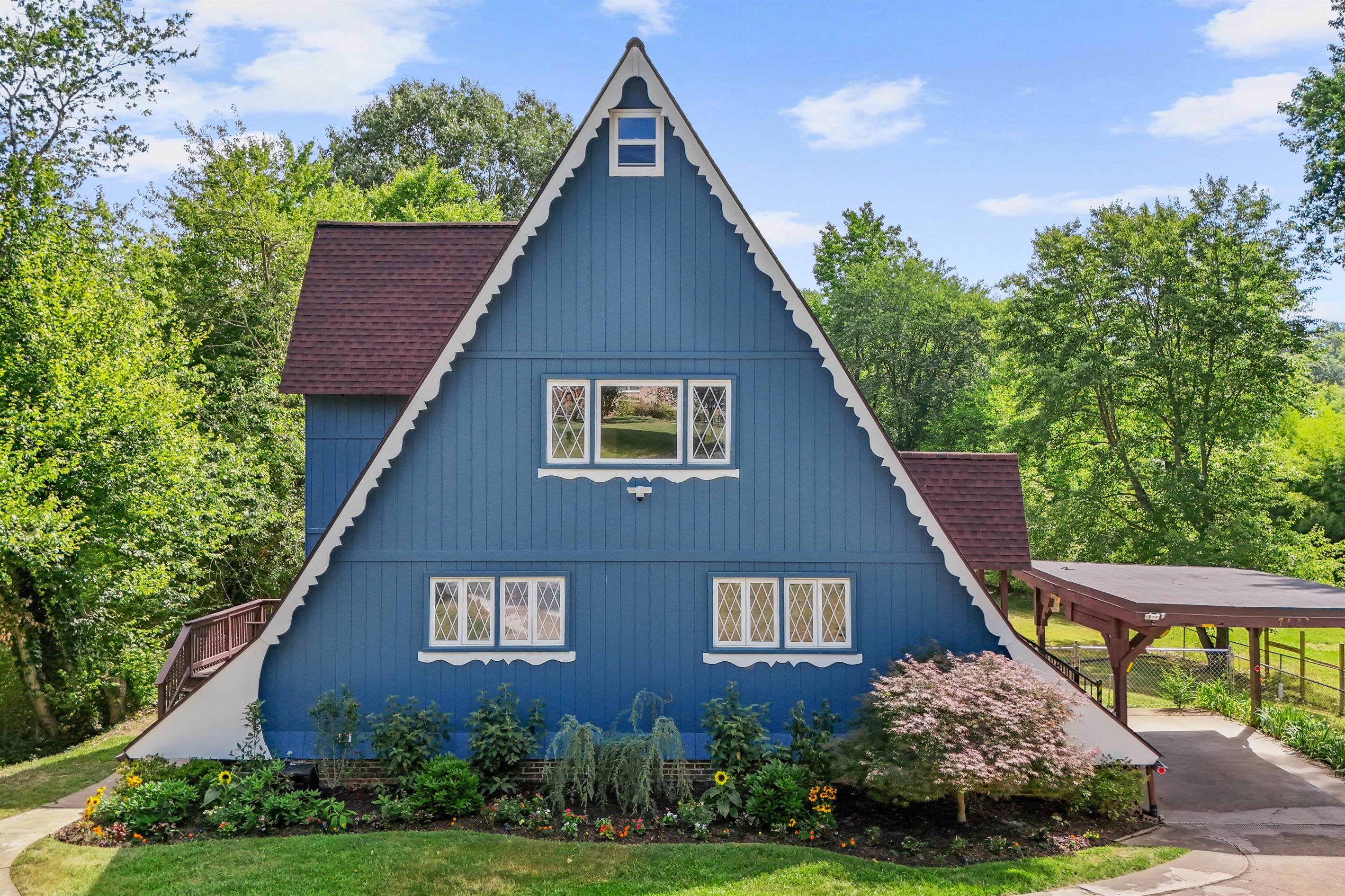 Escape to the Riverpoint, this unique house embodies the charm of a Swiss chalet A-Frame, complemented by a picturesque boathouse on the serene Canal of the Port Tobacco River.