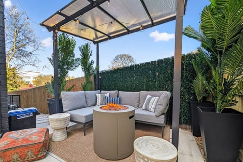 Lounge Patio | Fire Pit | Covered Seating
Kick back on the stylish outdoor sofa under a covered pergola, complete with a modern fire pit and lush greenery — your cozy spot for cocktails, chats, and golden-hour hangs.