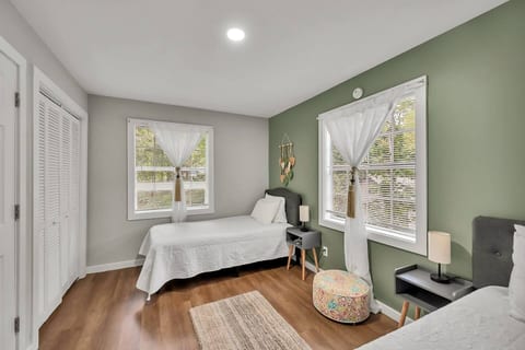Charming kids’ room with twin bed, Moroccan décor, high chair, pack & play, sound machine, and fresh linens—quiet and cozy.